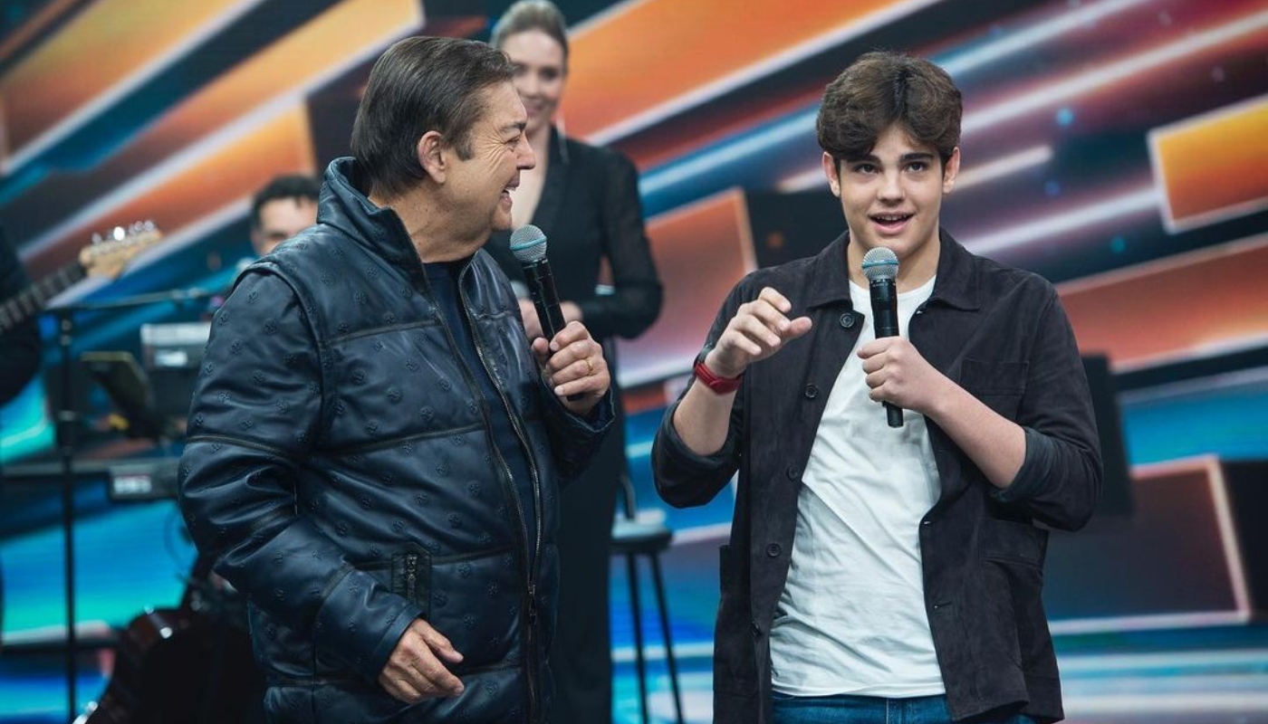 Faustão com o filho Rodrigo em despedida da Band